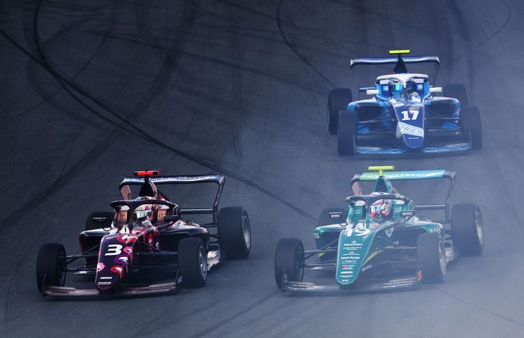 ZANDVOORT, NETHERLANDS - AUGUST 25: Lola Lovinfosse of France and Rodin Motorsport (3) and Tina Hausmann of Switzerland and PREMA Racing (19) battle for track position during F1 Academy Round 4, Race 1 at Circuit Zandvoort on August 25, 2024 in Zandvoort, Netherlands. (Photo by Joe Portlock/Getty Images)