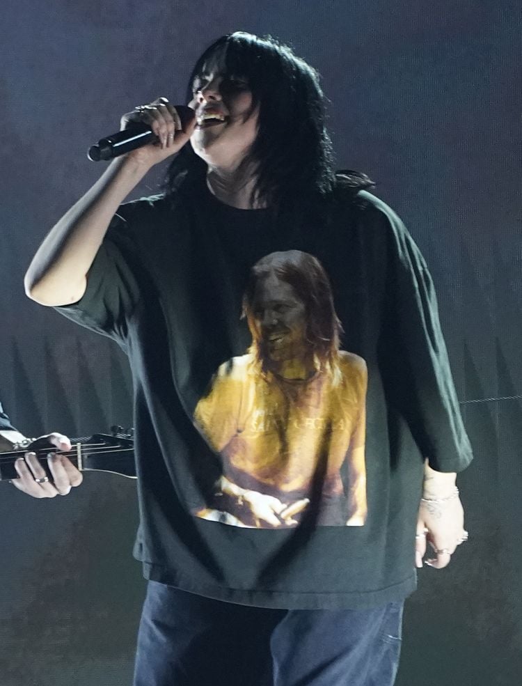 The late Taylor Hawkins appears on the shirt of Billie Eilish as she performs 