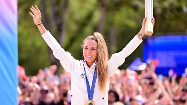 French Pauline Ferrand Prevot celebrates on the podium with the gold medal after winning the women's cross-country cycling race of the Paris 2024 Olympic Games, at the Colline d'Elancourt climb near Paris, France on Sunday 28 July 2024. The Games of the XXXIII Olympiad are taking place in Paris from 26 July to 11 August. The Belgian delegation counts 165 athletes competing in 21 sports. BELGA PHOTO LAURIE DIEFFEMBACQ